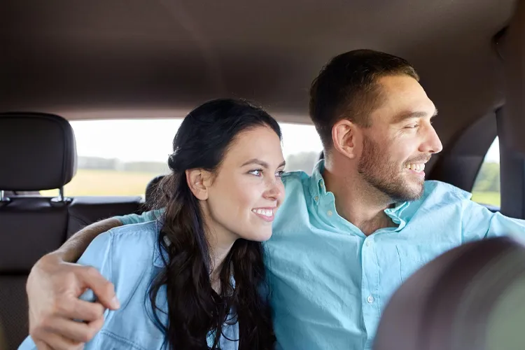 Couple traveling in a chauffeur